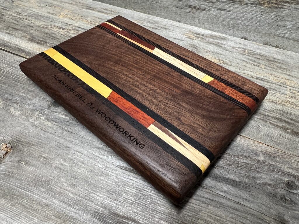 Chef Petite Cutting Board - Walnut with (yellows & reds) Mosaic and Black Inlay Stripes