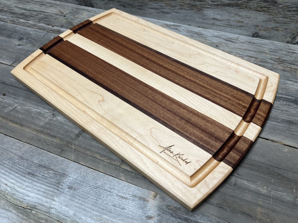 Handcrafted Maple, Walnut, and Sapele Cutting Board